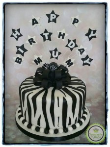 Black and White zebra print birthday cake with bow and stars
