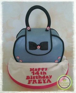 Blue & black handbag birthday cake with flowers