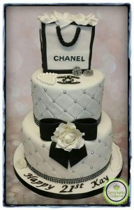 Chanel tiered birthday cake with logo, beads, bow and bling