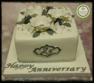 Silver 25th wedding anniversary cake with flowers and Holly
