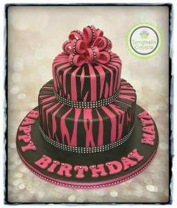 Black & pink zebra print birthday cake with bow and bling