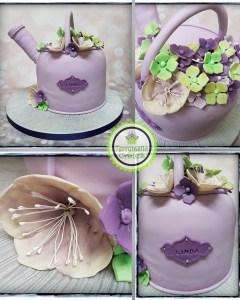 Watering can with flowers cakep